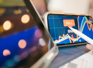 Trader reviewing Bitcoin, Ethereum and forex options across multiple markets
