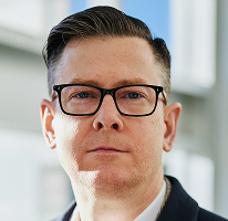 Alexander Hughes, CEO of a crypto trading company, executive portrait